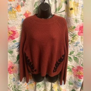 Burnt orange and black knitted sweater